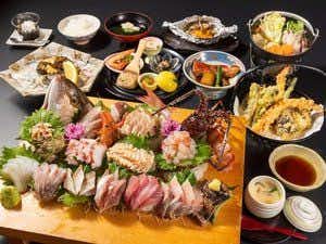 Hanachouen with a generous seafood dinner centered on a sashimi boat.