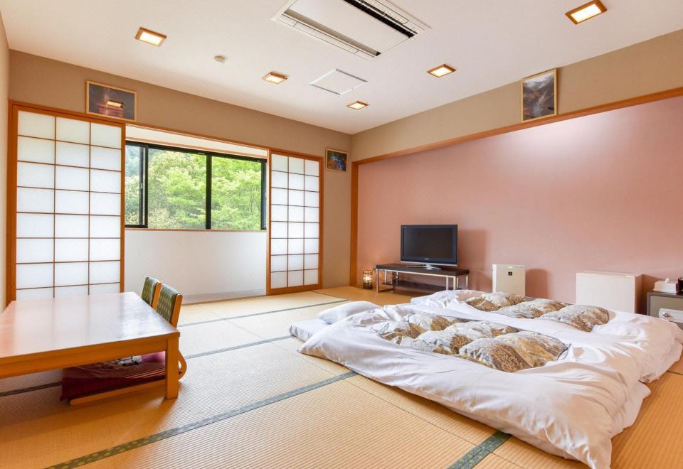 A Japanese guest room prepared with futons.