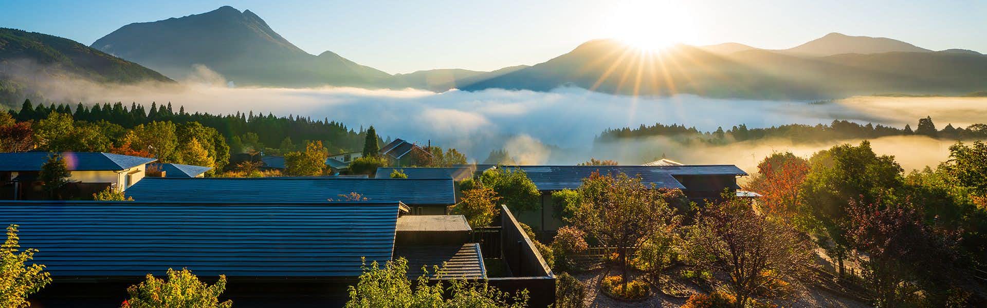 Yufuin Hanayoshi with a View of the Morning Mist with morning mist glowing between mountain ridges.