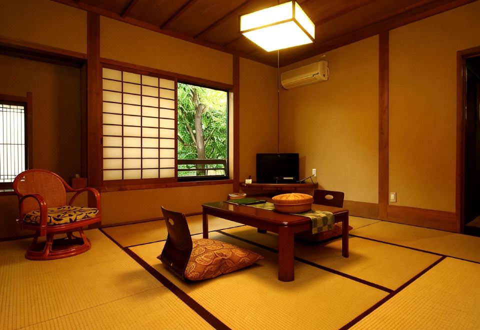 A traditional room with a low table and garden view.