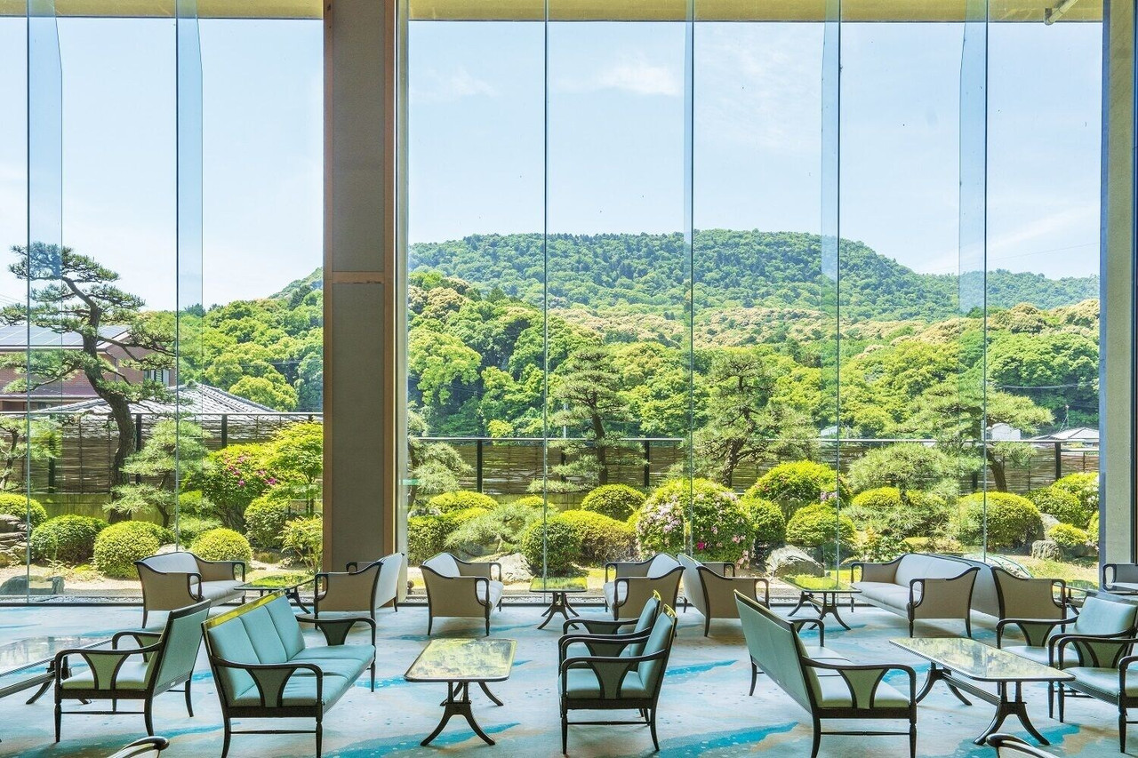 Dining area overlooking landscaped grounds.