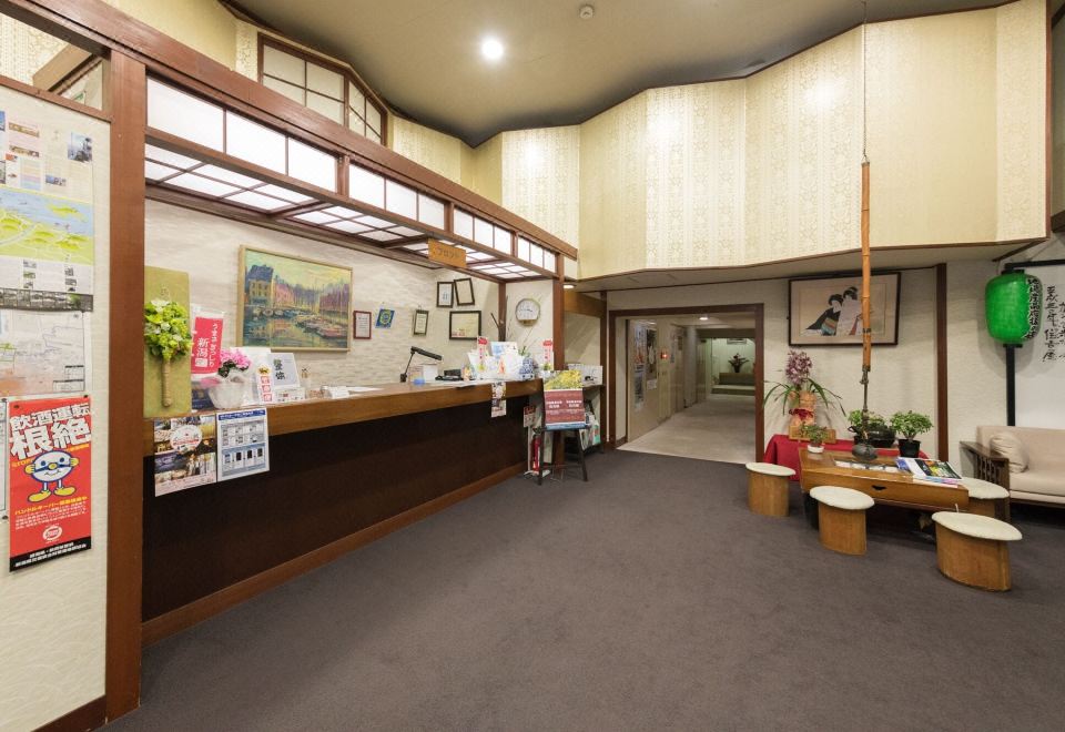 A reception lobby with a long counter and local displays.