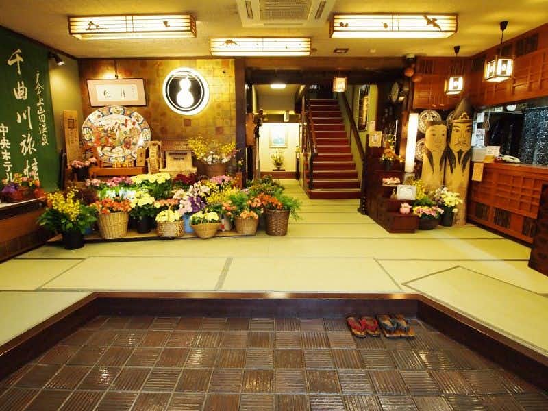 Central Hotel:Traditional Japanese style inn with a floral entrance lobby with timber counter and broad staircase.
