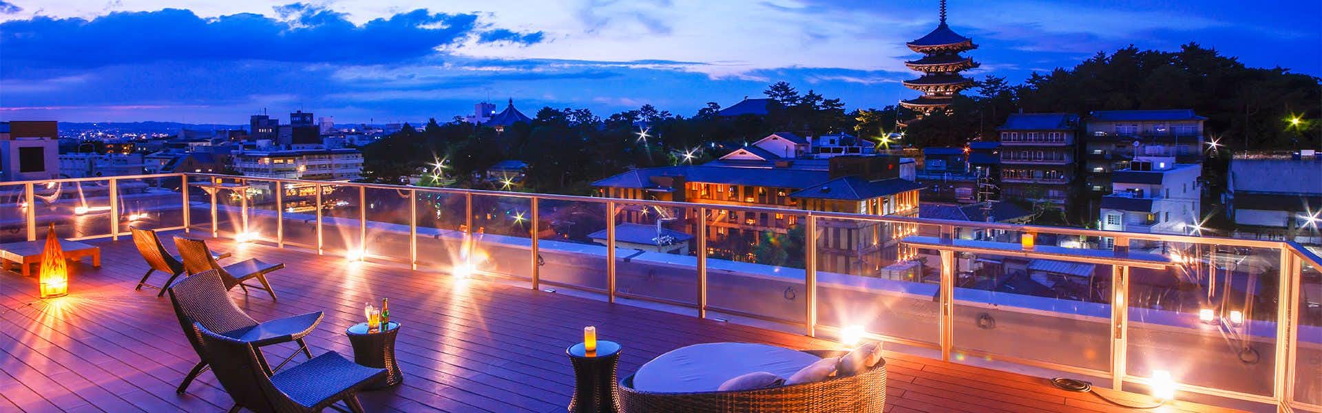 Asukasou Inn in the Ancient City of Nara with a rooftop terrace overlooking Kofukuji Pagoda at blue hour.
