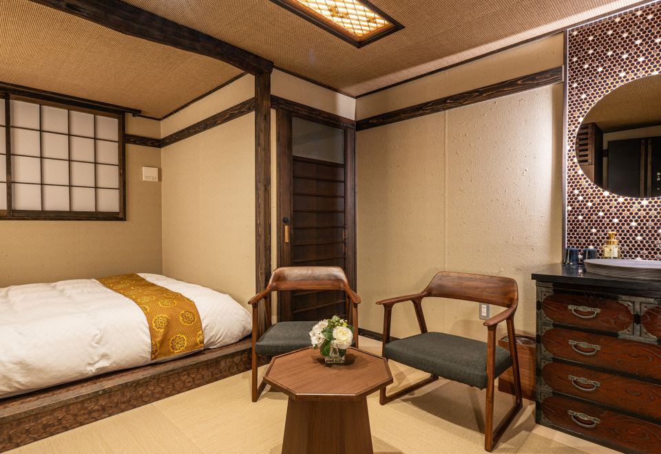 Japanese-style room with futon bedding and seating.