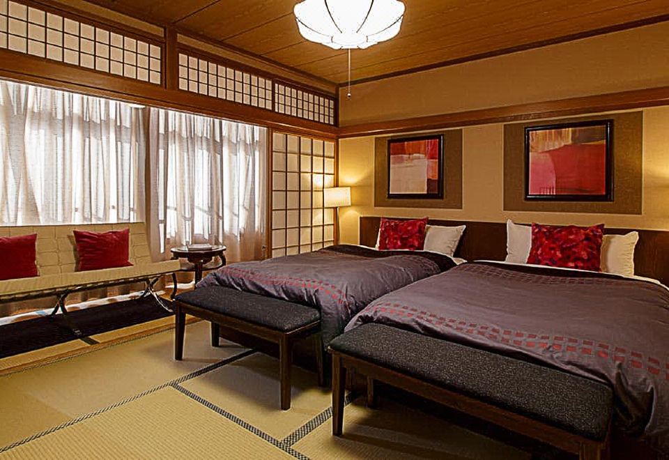 Guest room with beds and seating.