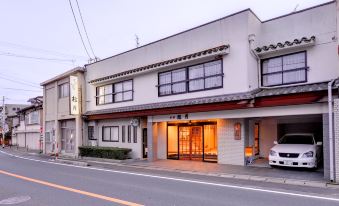The ryokan facade beside the street.