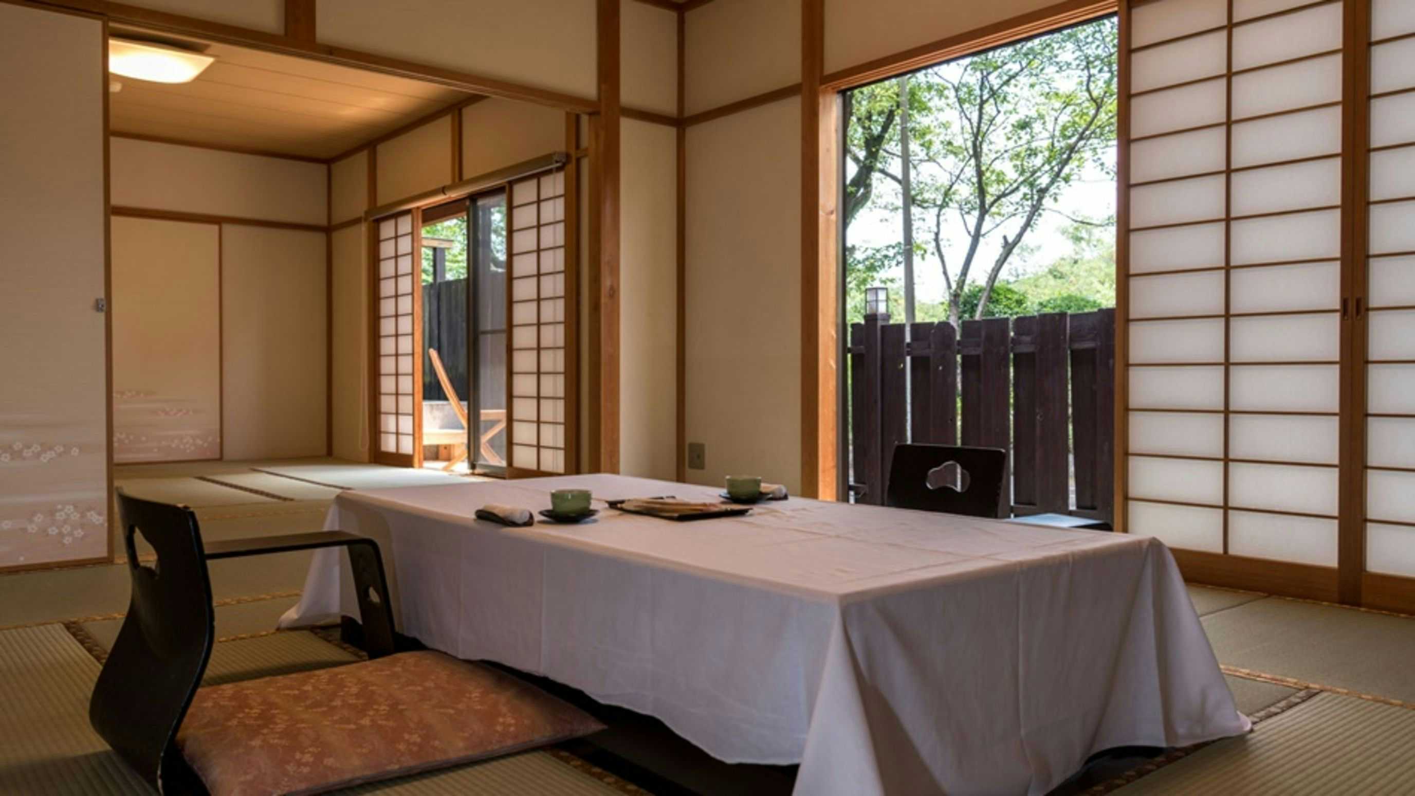 Kappo Ryokan Daishinkan Goku with a private tatami dining room with a long low timber table.