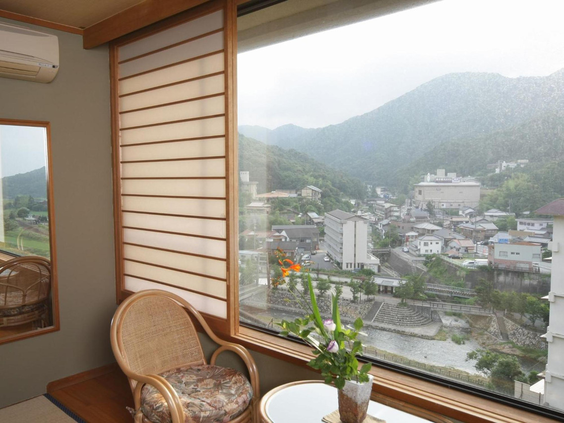 Window-side seating with a town view.