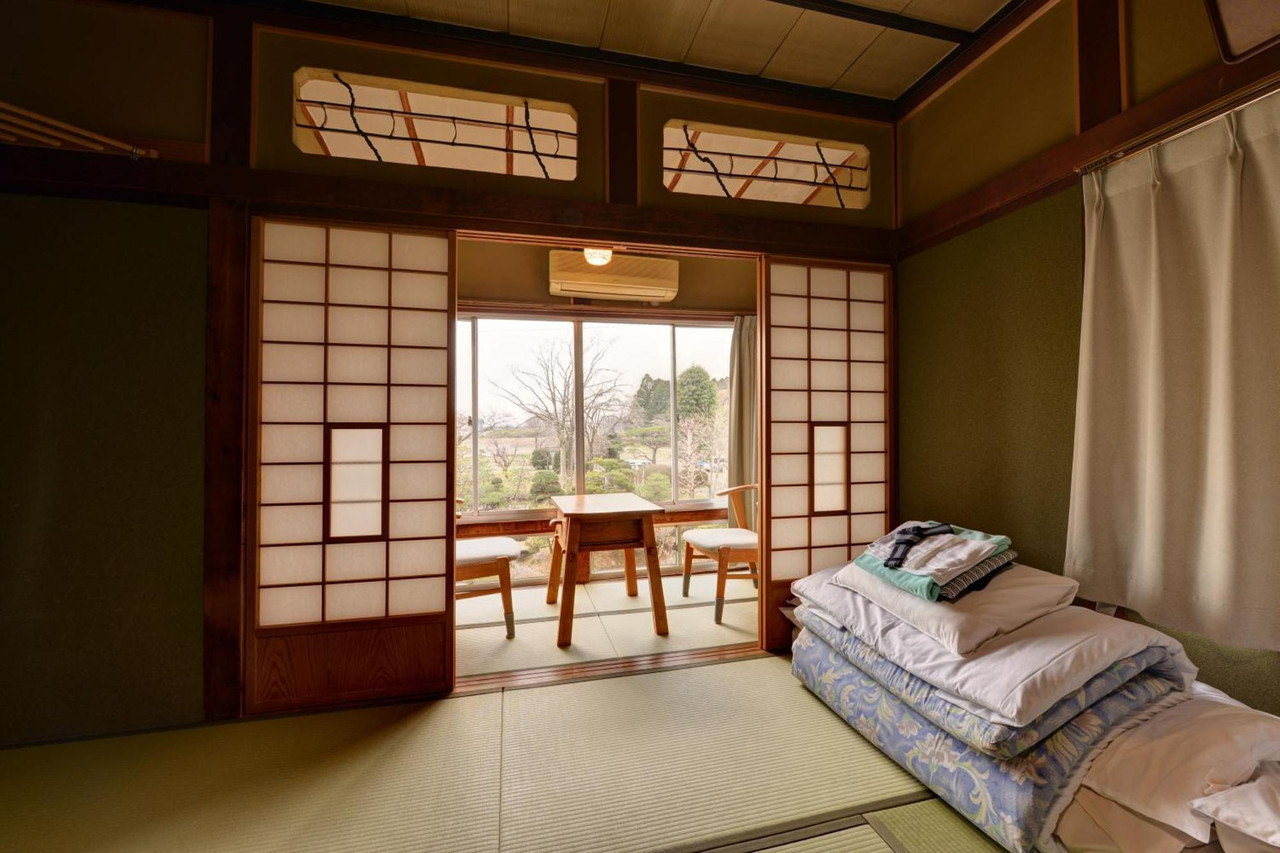 A quiet interior opens to a bright bathing room.
