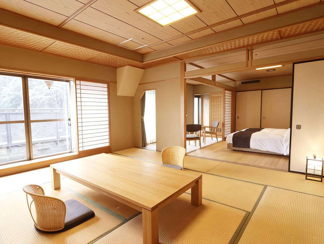 A bright tatami-floored interior opens toward a windowed sitting area.