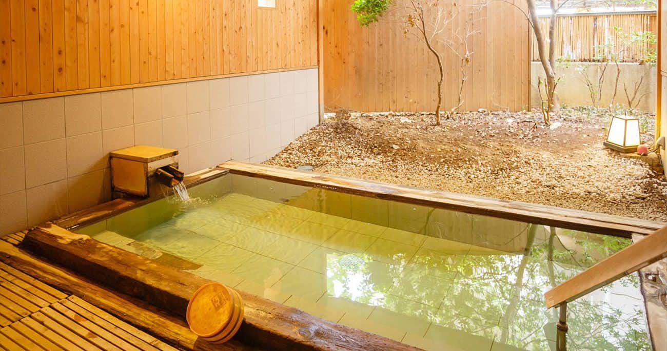Kikyotei Yumotoya with a private rectangular bath set within pale timber walls.