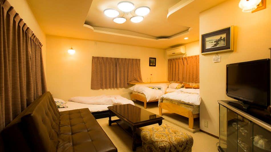 Hinata-ya with a family bedroom with western beds and sofa seating.