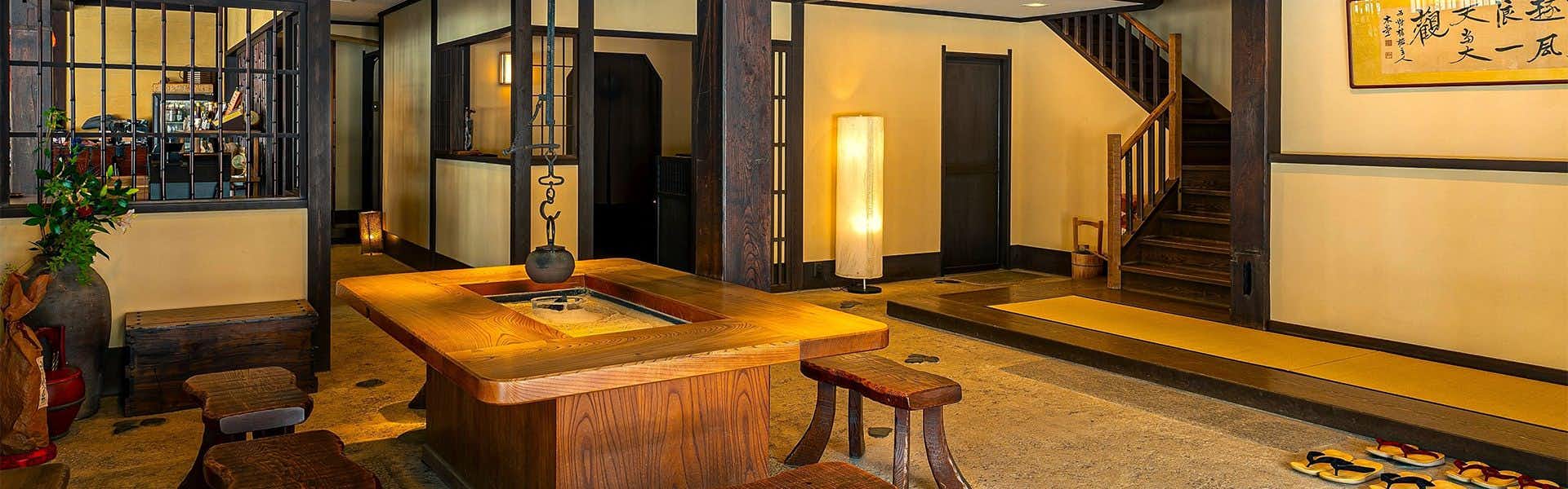Amanohashidate Onsen Taikyourou with a panoramic tatami lounge with broad windows overlooking the water.
