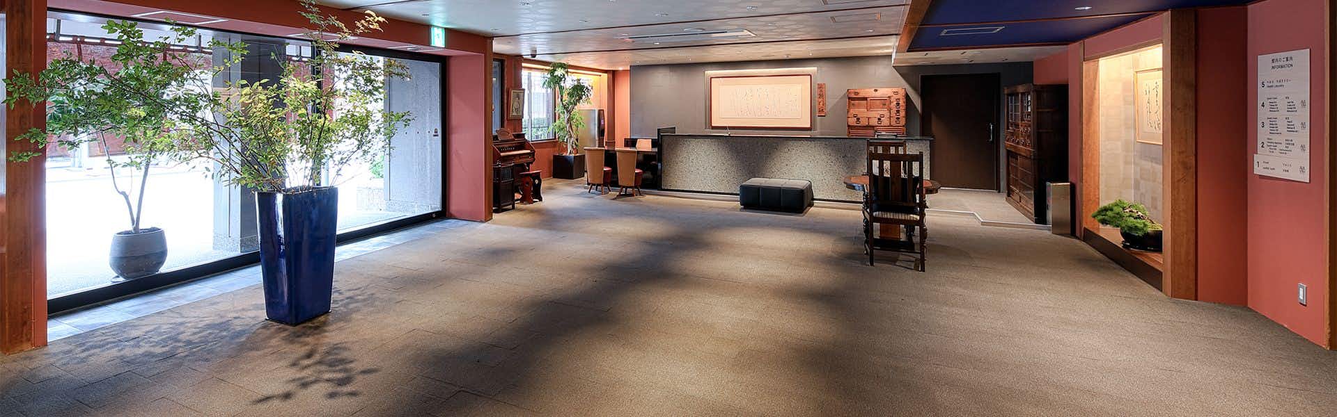 Gion Shinmonso with a contemporary lobby with dark floors and warm lighting.