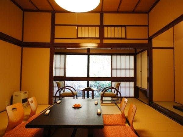 Relaxing Inn Kiyunso with a warm tatami room with low table and window seating.