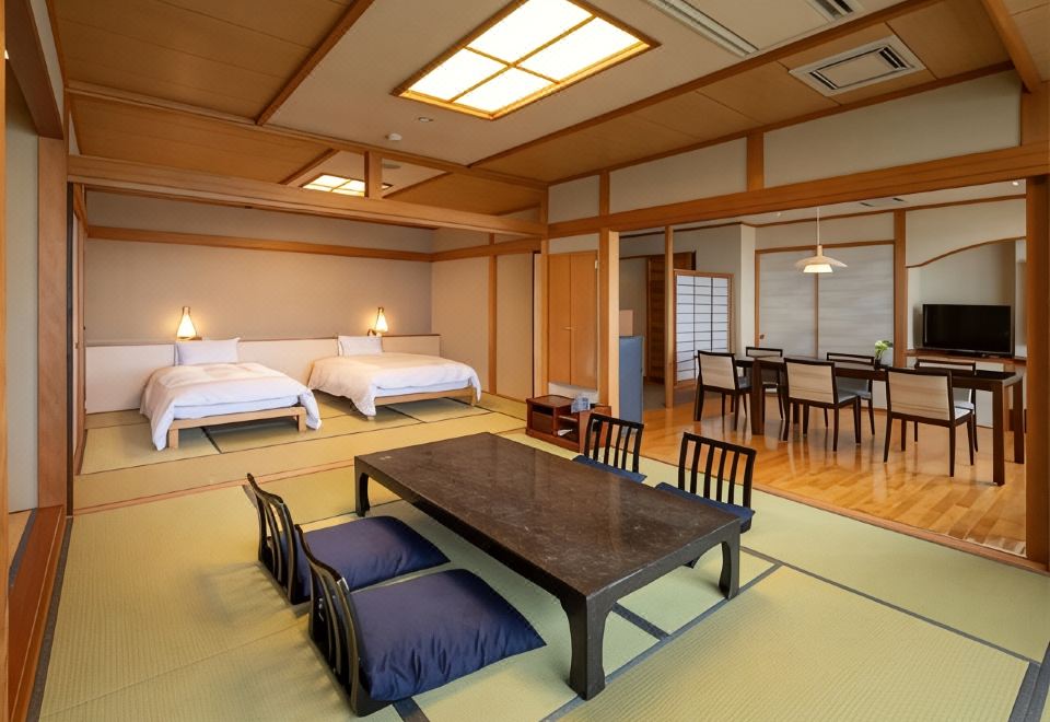 A Japanese room with twin beds and a table.