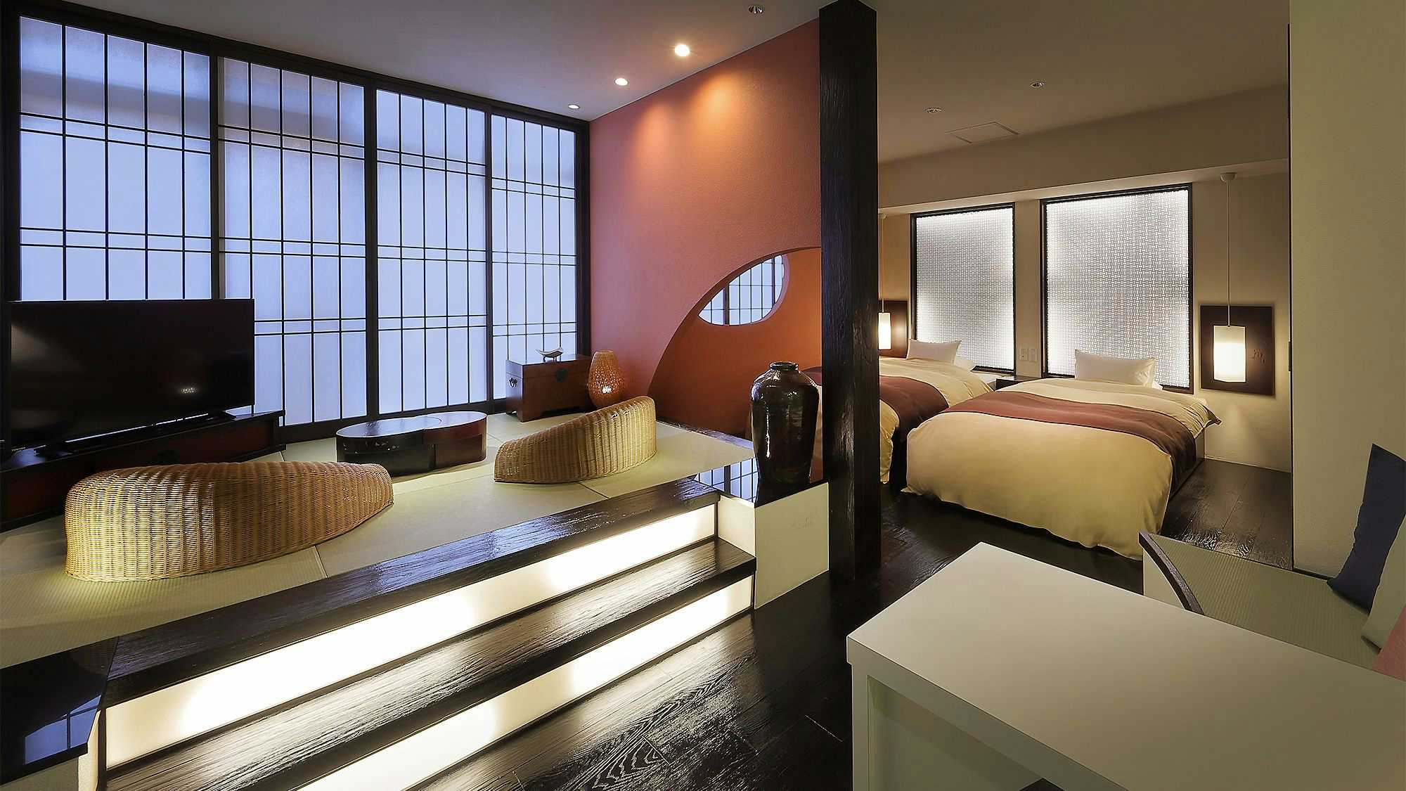 Yamayuri Inn with a split-level suite combining twin beds and tatami seating.