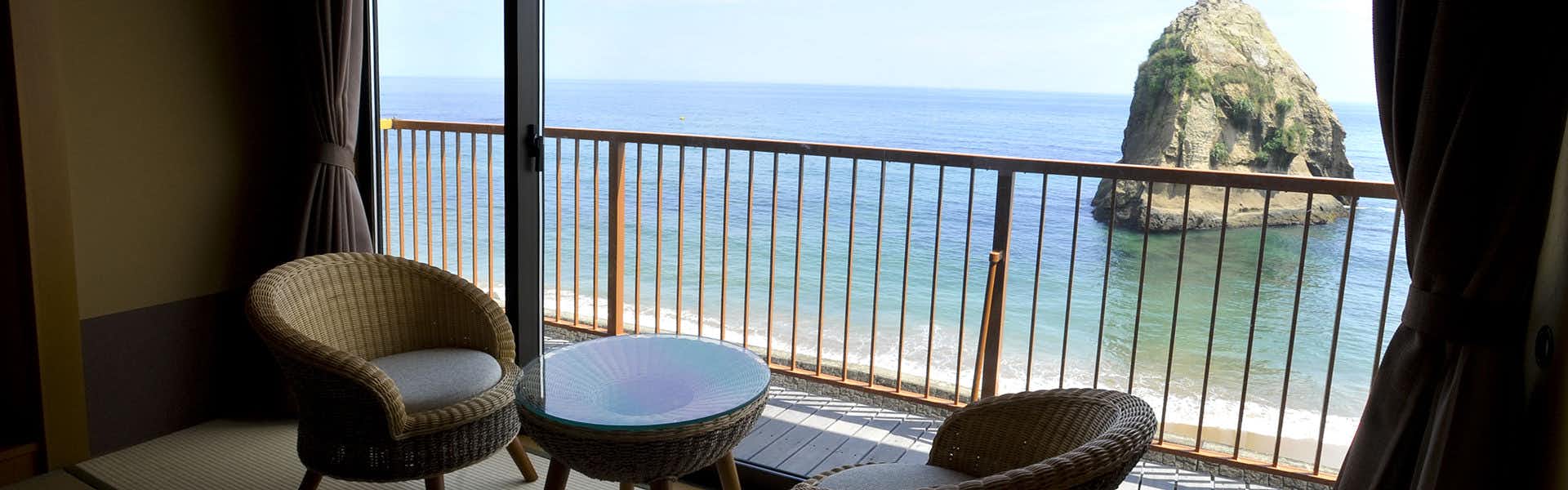 Futatsushima Kanko Hotel with an ocean-view guest room facing the offshore rock.