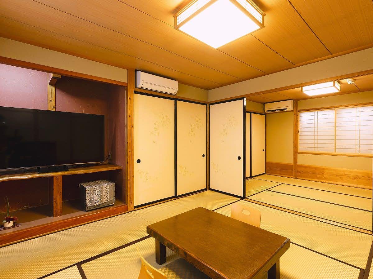 Onyado Yufuin-tei with a spacious tatami room with low wooden table.