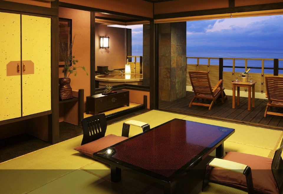 Tatami room with a low table and ocean-facing terrace.