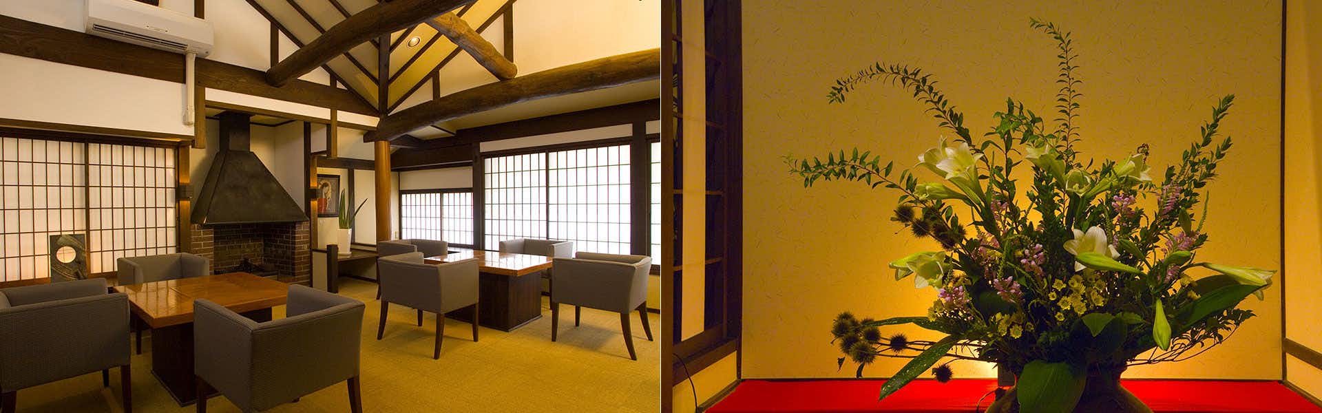 Yufuin Nanakawa Stone floor interior with wooden ceiling beams, latticed window screen, dark wood table, brown upholstered chairs.