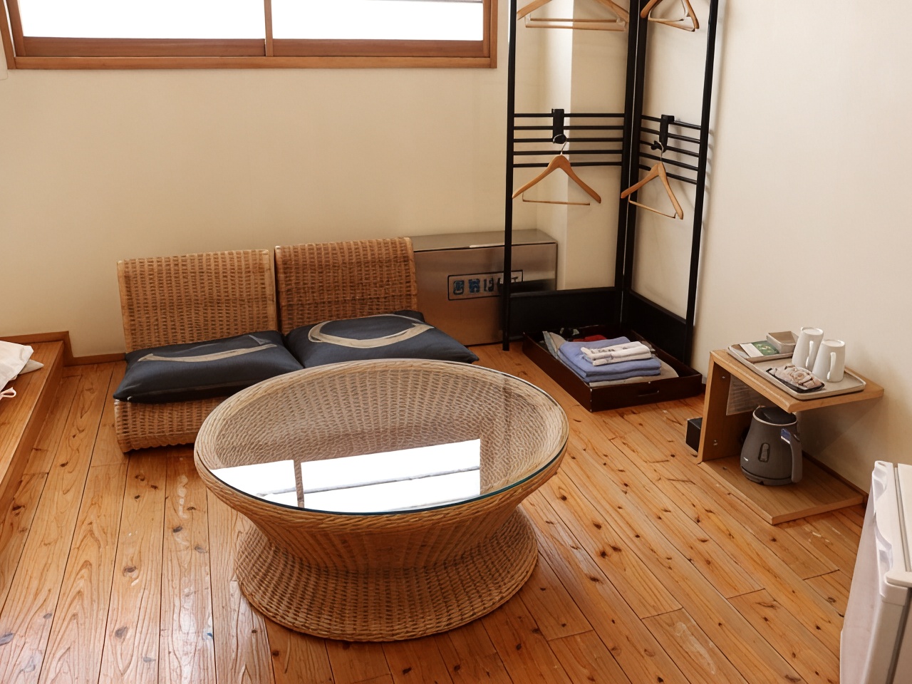 Room with a round table and window.