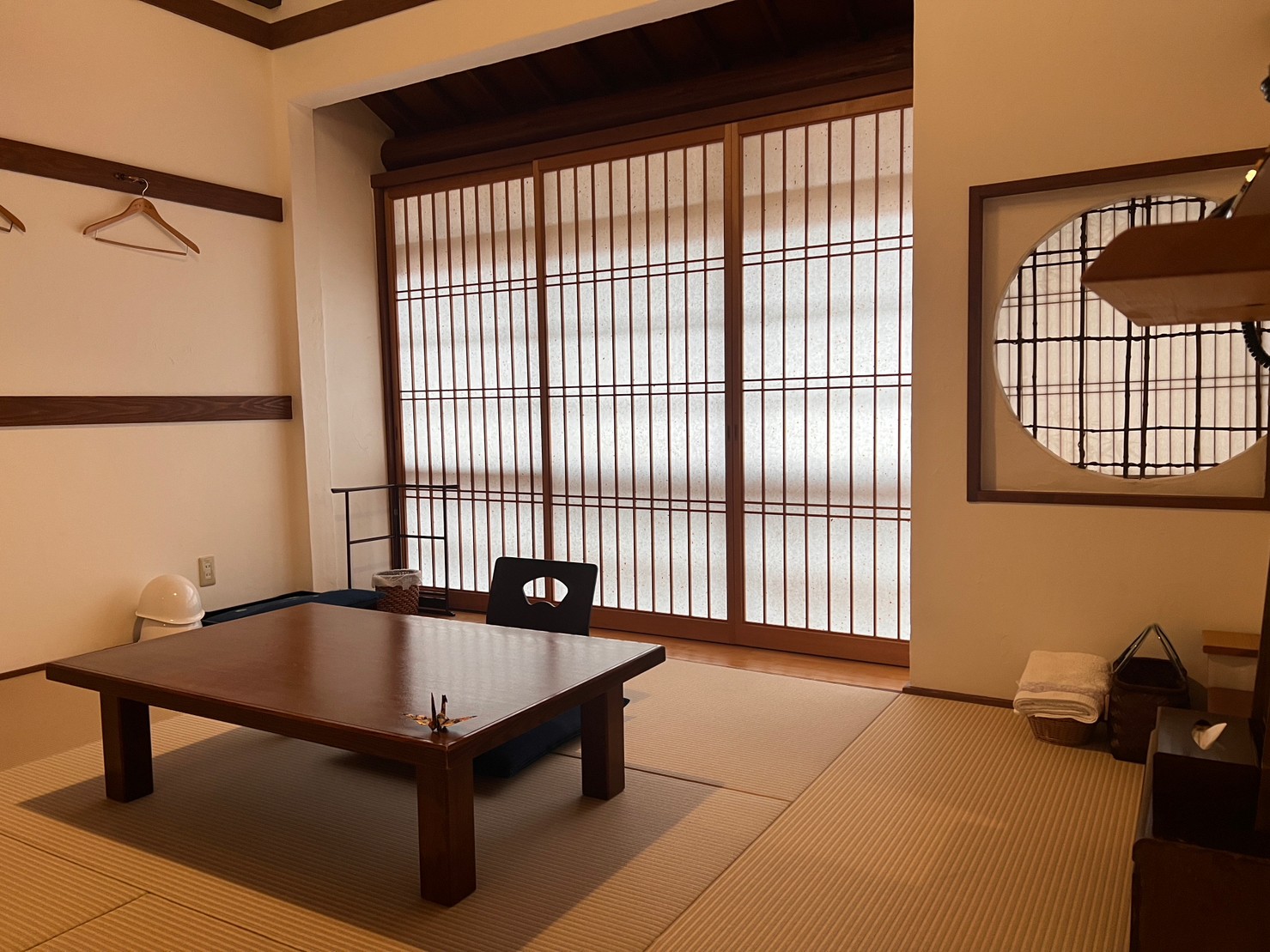 Tatami seating area with shoji screens and a low table.