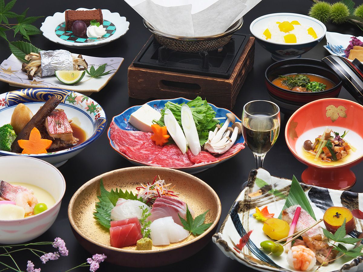 A Japanese dinner of sashimi and hot dishes.
