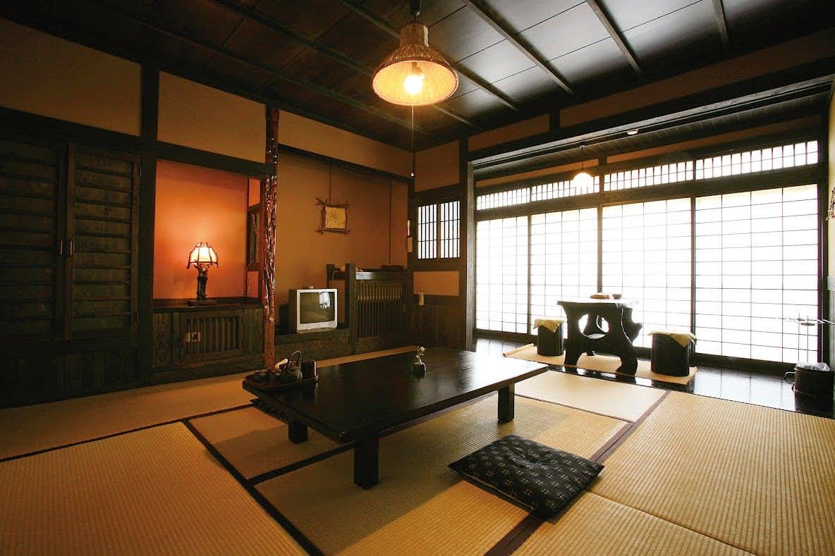Fukumotoya a tatami room with a low table and shoji windows.