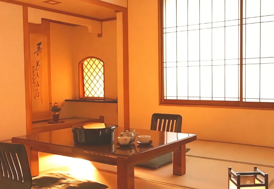 A low table and chairs in a warmly lit traditional room.