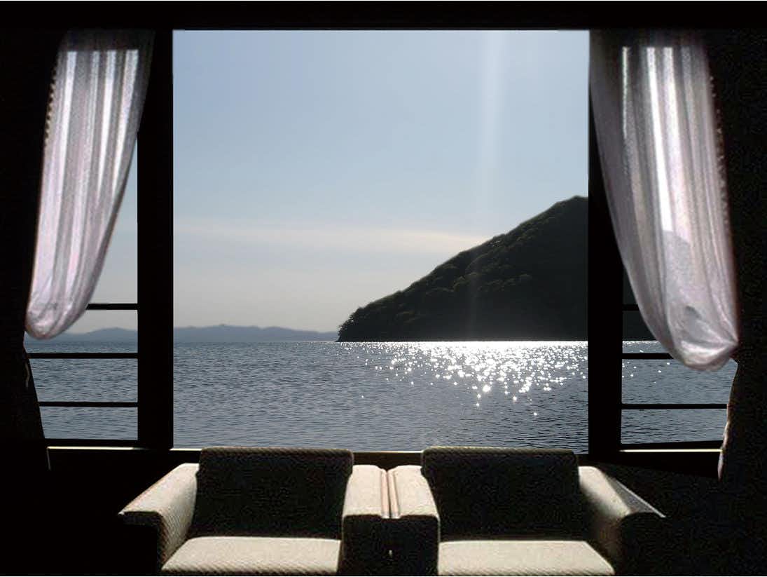 Spectacular View Inn Asamushi Sakura Kanko Hotel with a tatami guest room opening toward a panoramic ocean view.