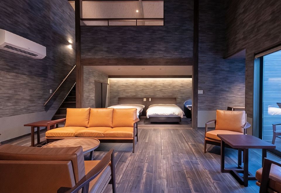 Guest room with beds and seating.