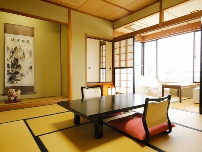 Wakura Onsen Housenkaku with a peaceful tatami room with low black table.