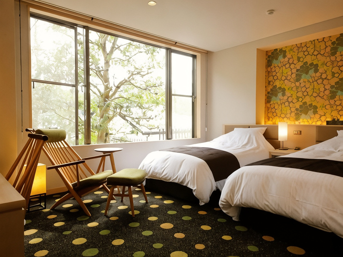Twin room with a colorful floral accent wall.
