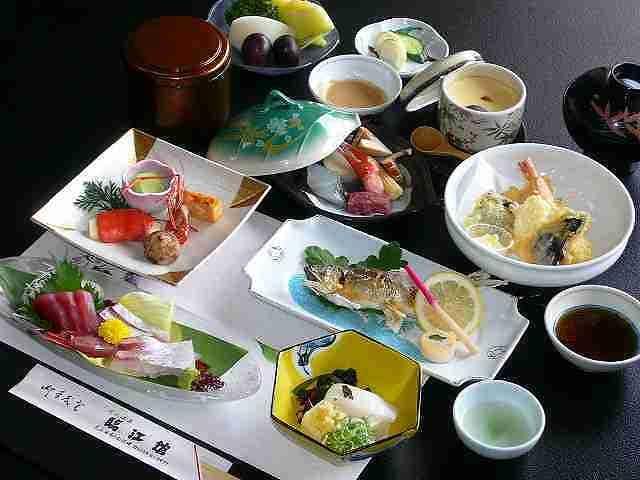 Rinkokan with a Japanese dinner presented in colorful lacquered dishes.