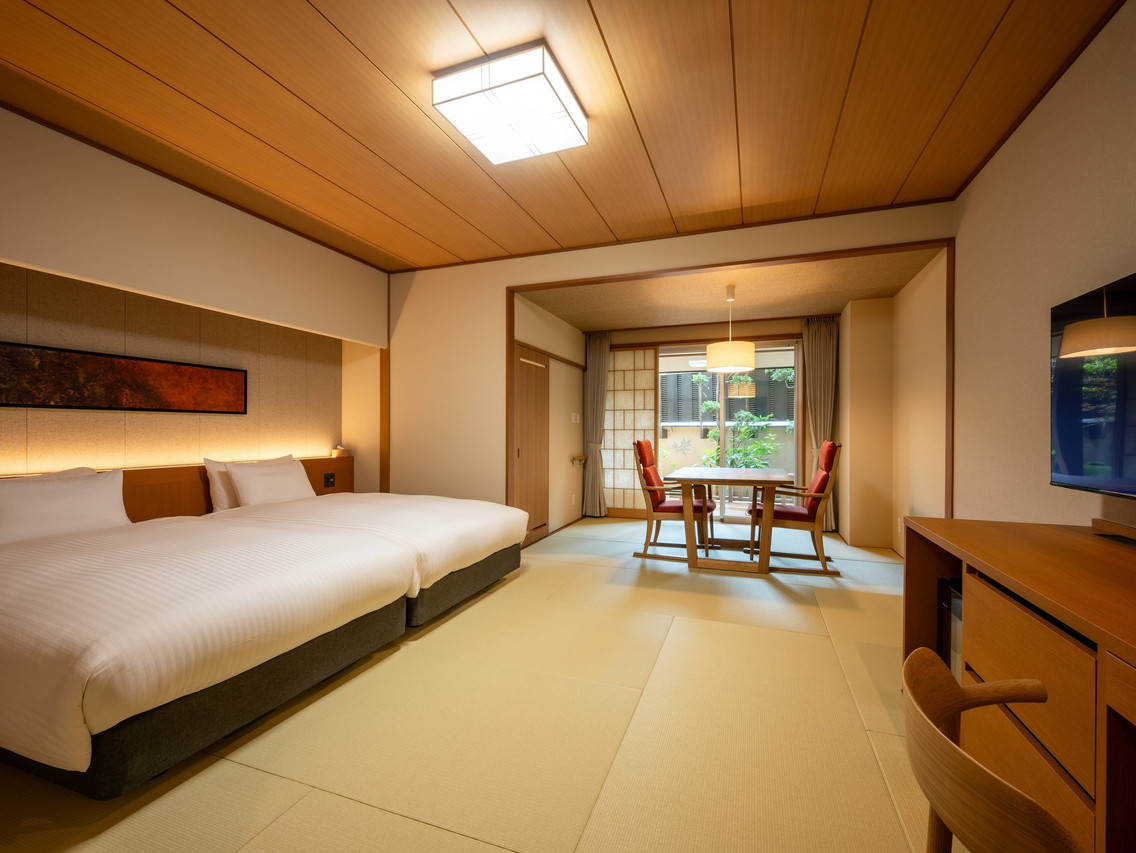A bright room combines beds with a traditional sitting area.