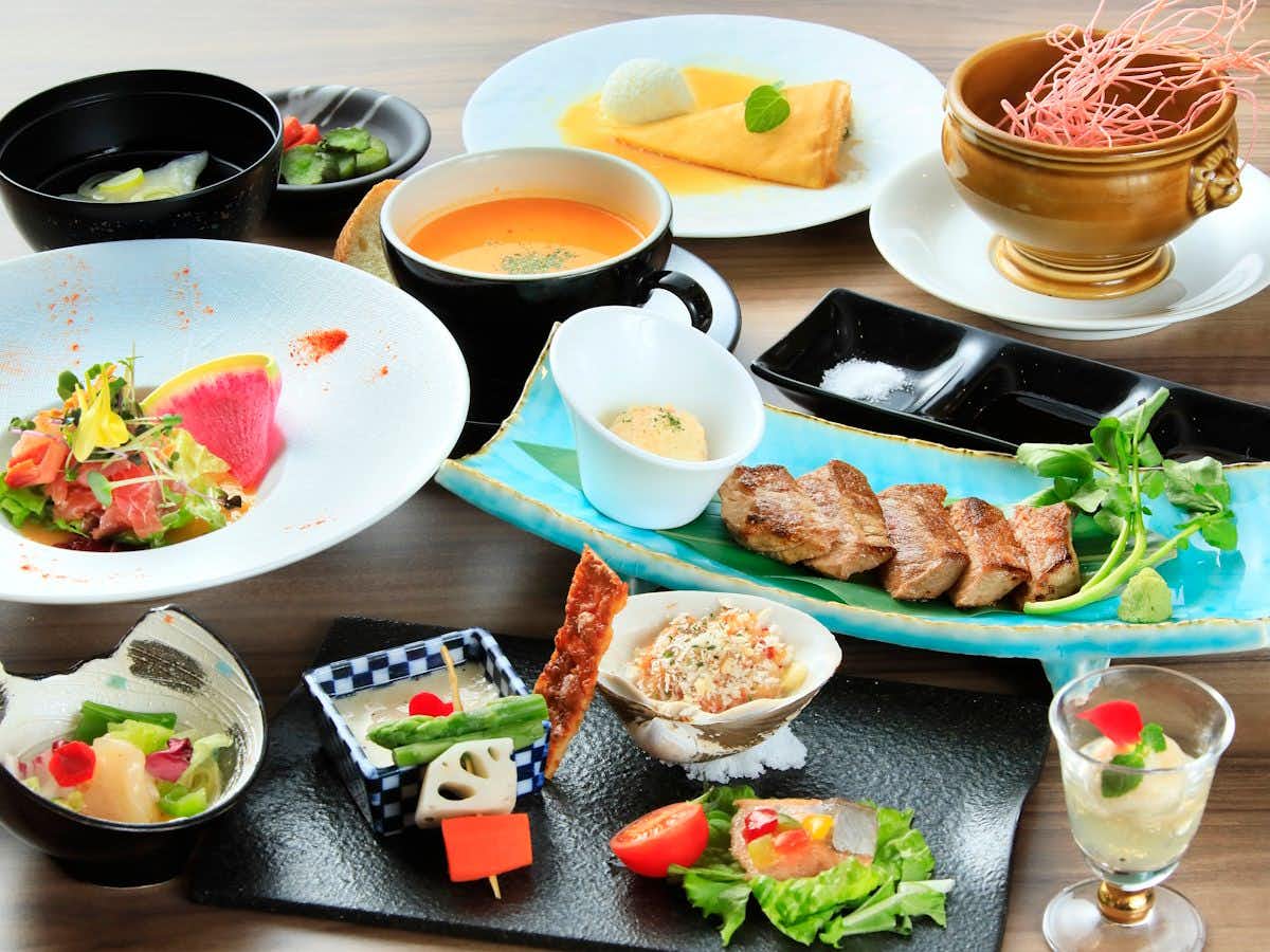 Naruko Fuga with a refined dinner arranged across modern white tableware.