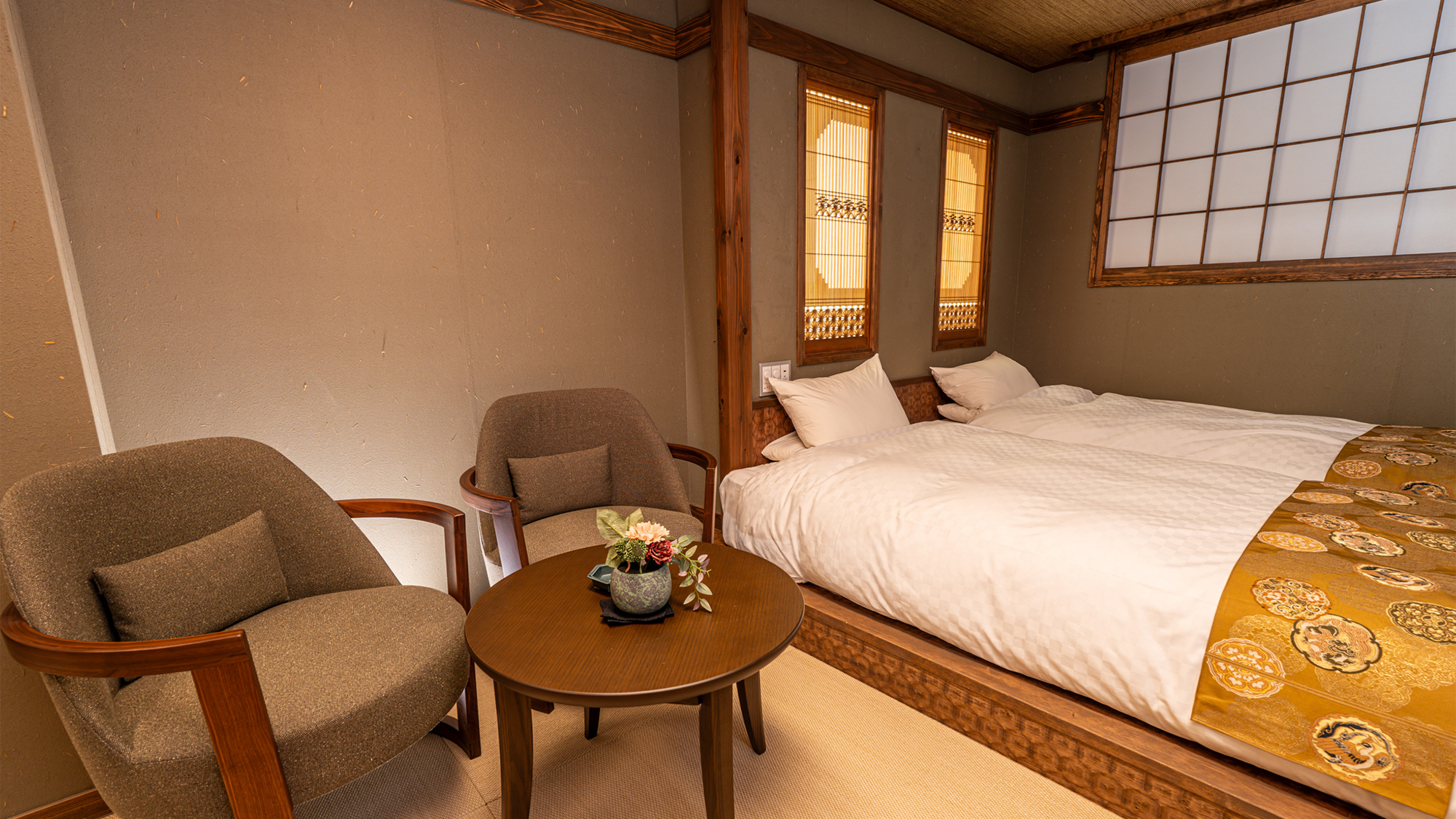 Japanese-style room with futons and a central table.