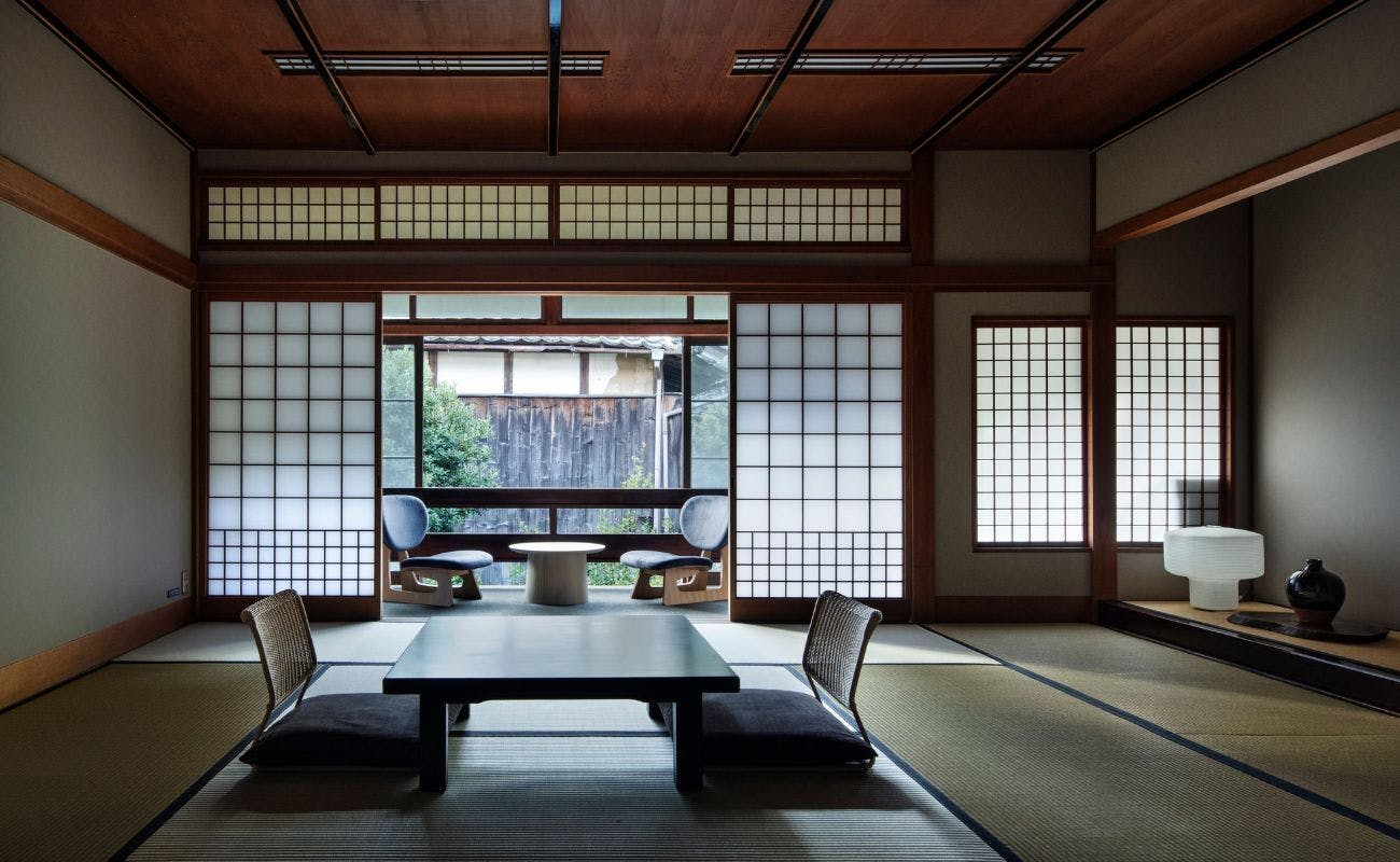 Kinosaki Onsen Kobayashi-ya with a traditional tatami room with a low table and garden windows.
