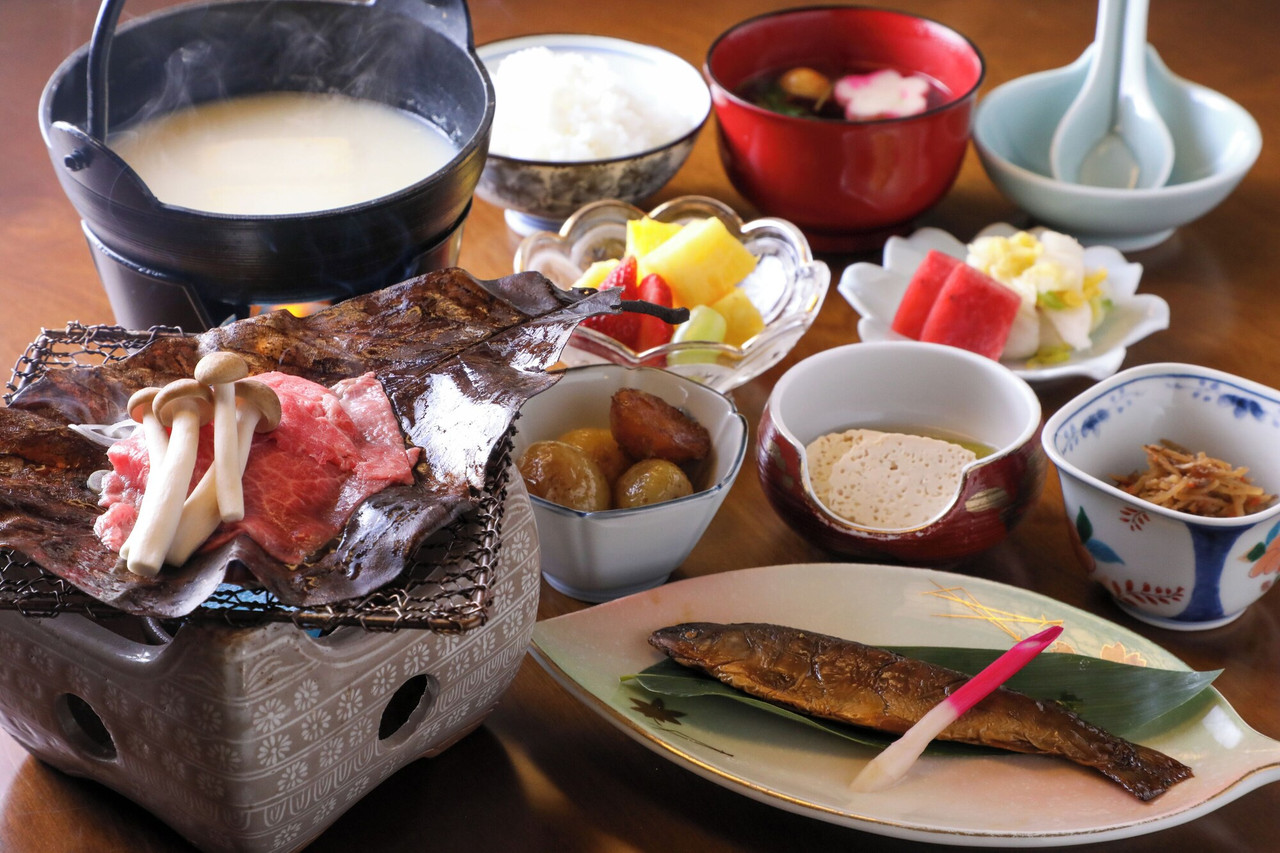 Japanese meal with multiple dishes.