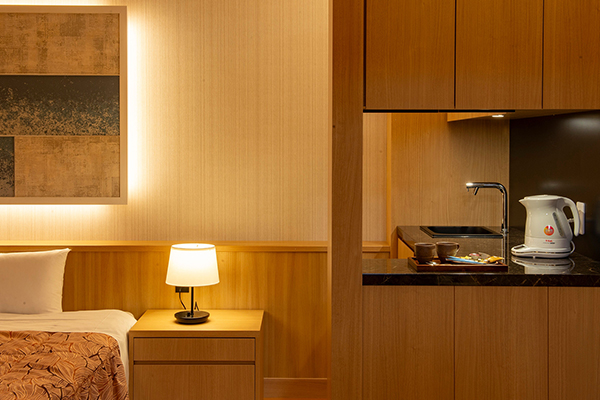 Compact guest-room sleeping and refreshment area.