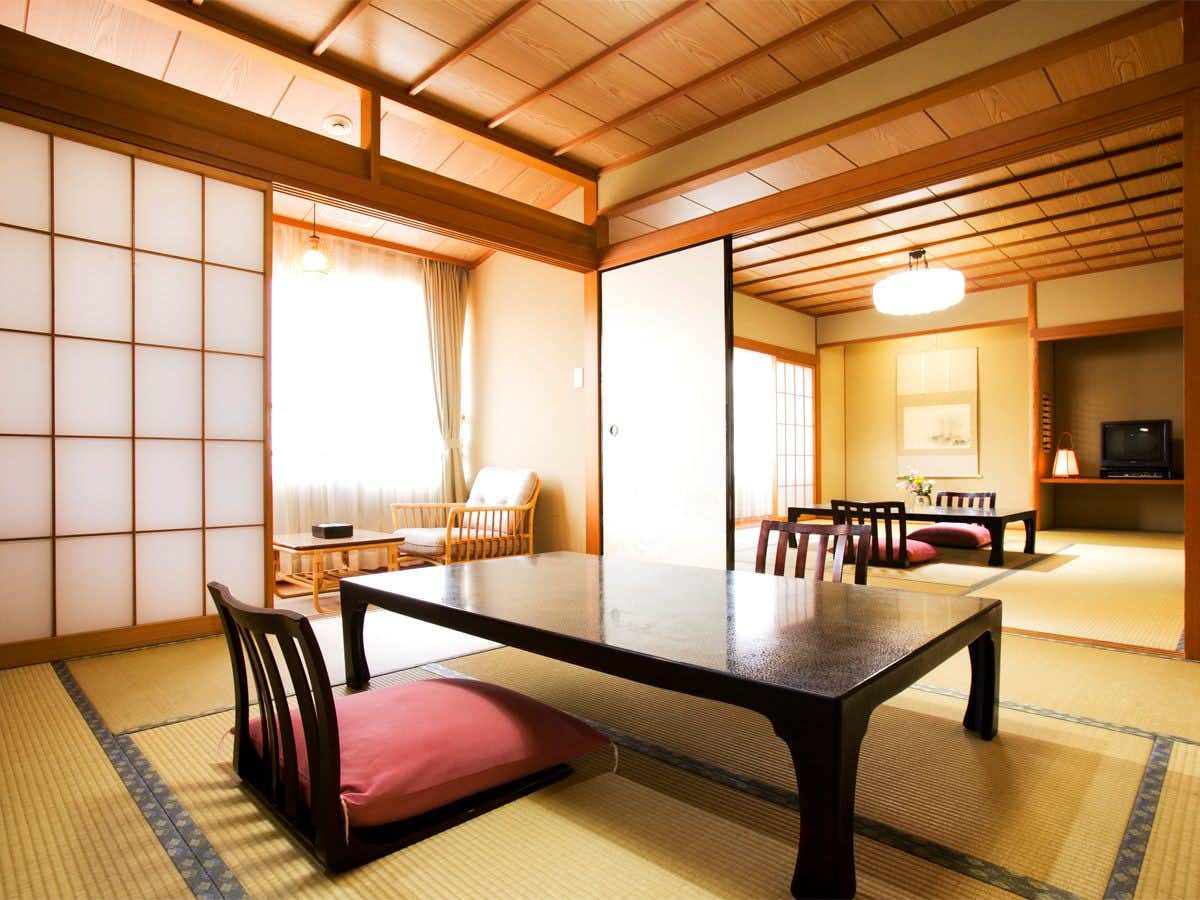 Ryotei Yamanoi with a bright tatami room with low table and window seating.