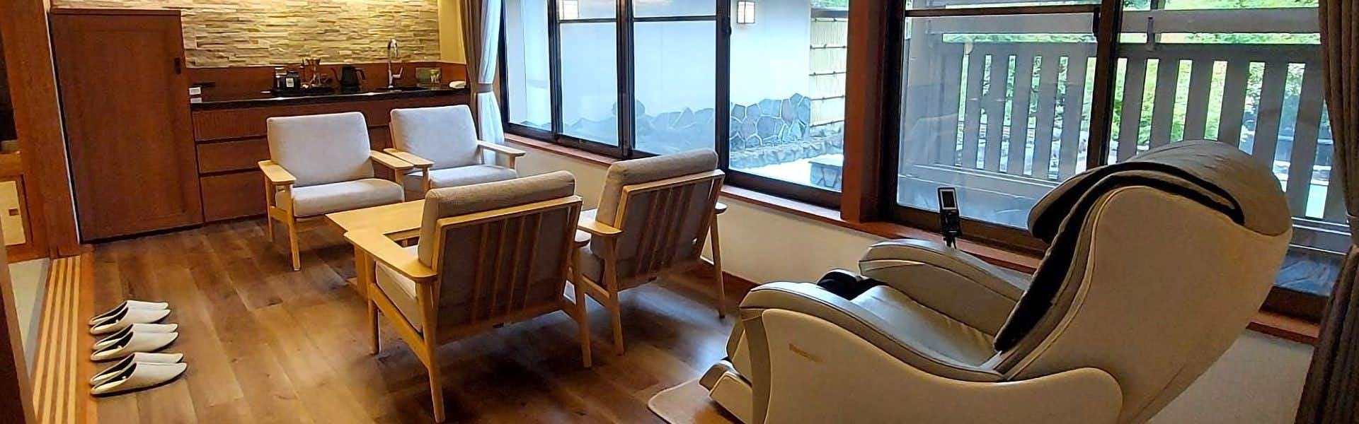 Seifutei with a quiet lounge with cushioned chairs beside broad windows.
