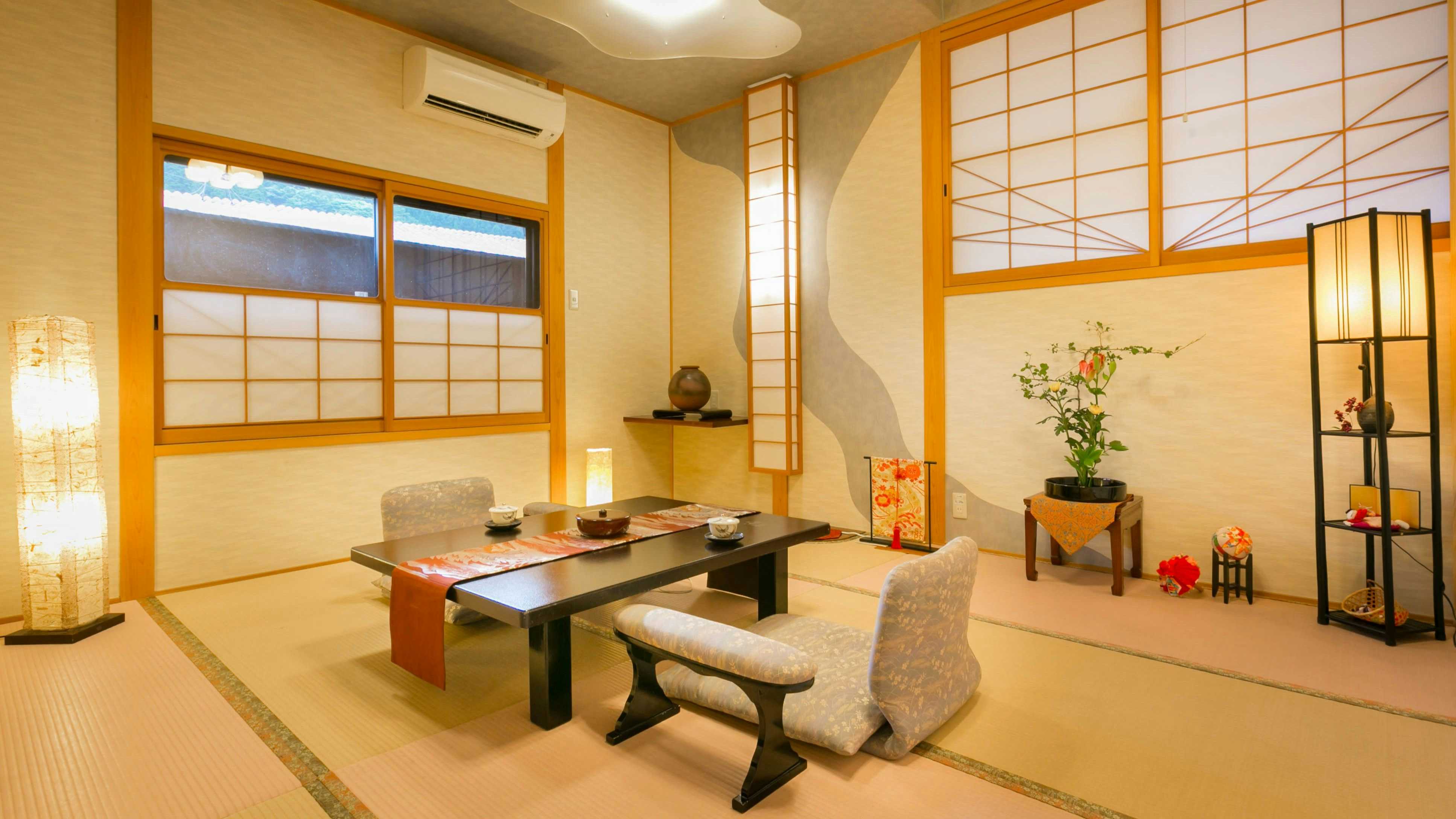 Matsunoya Hanaizumi with a bright tatami room with low table and floor chairs.
