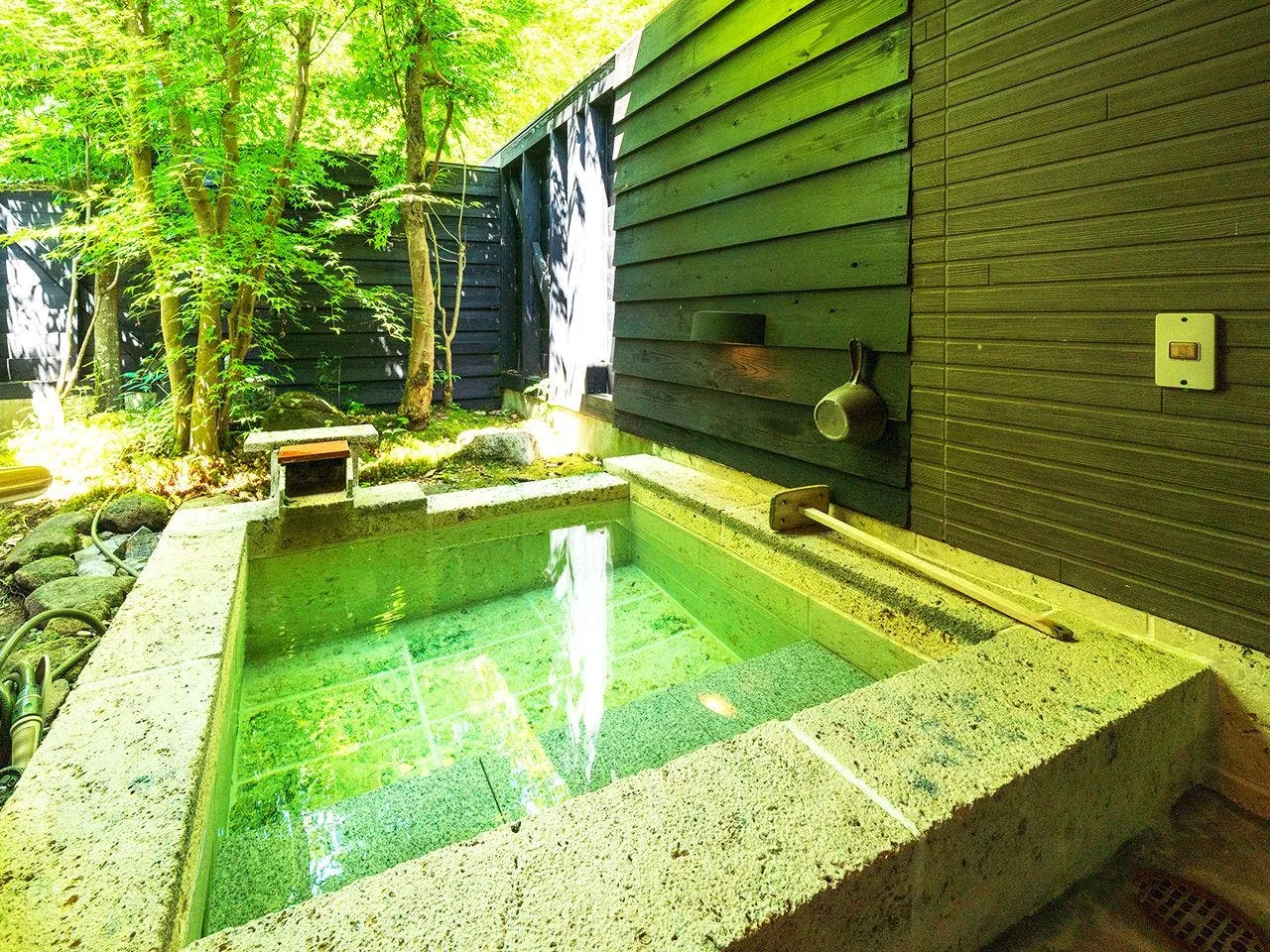 Private stone rotenburo fed directly by the Shibo alkaline onsen spring