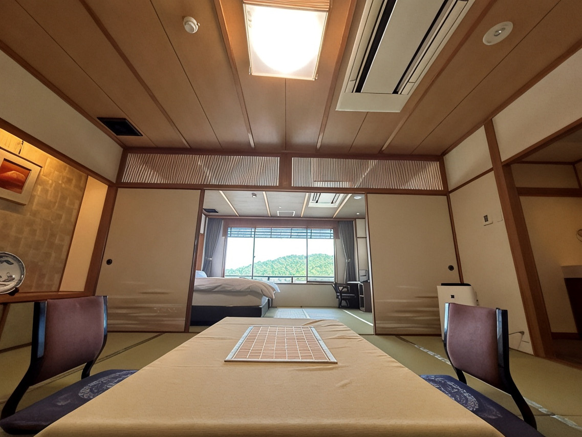Japanese-style room with a low table and windows.