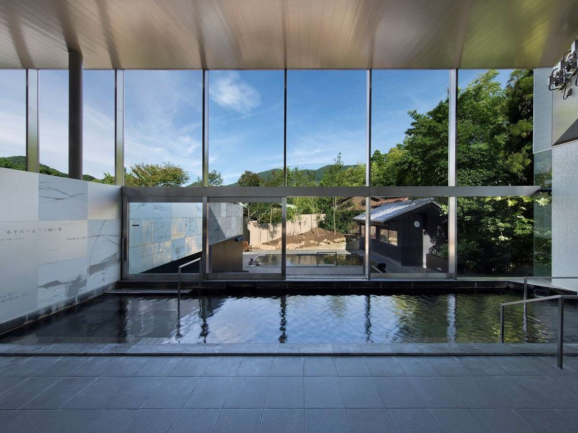 Indoor pool with garden-facing windows.
