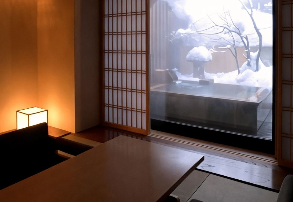 A traditional room with a low table beside a window.