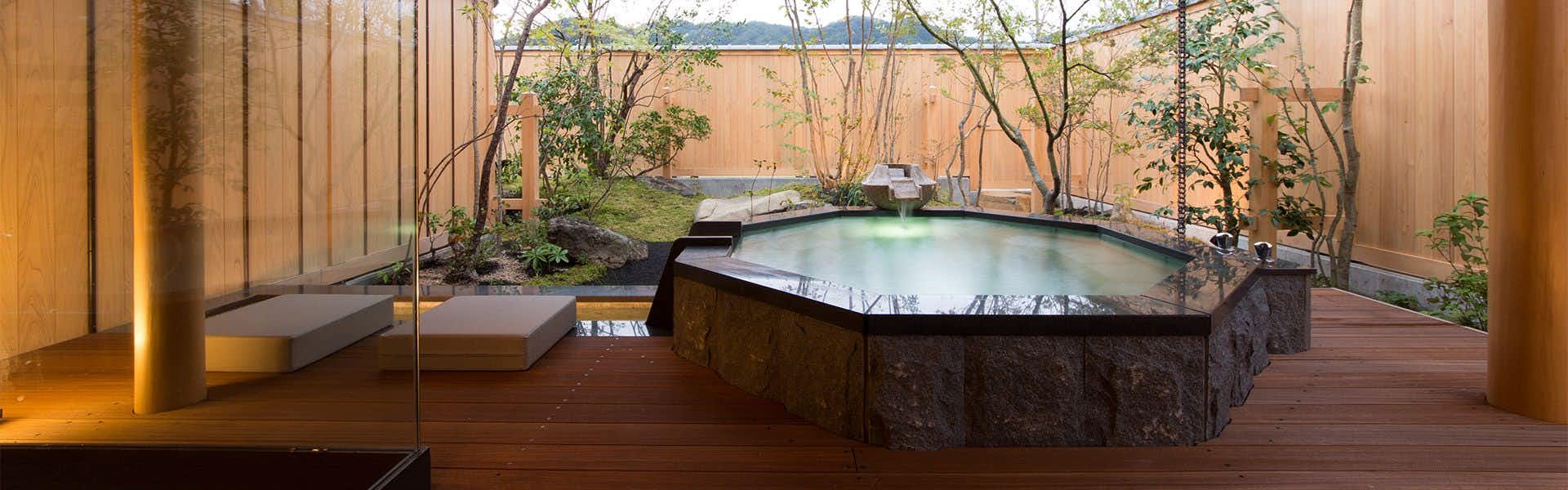 Saginoyu Inn with a private garden terrace with two round outdoor baths.